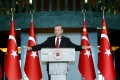 Turkey's President Tayyip Erdogan addresses the audience during a meeting in Ankara, Turkey, January 12, 2016. Erdogan said on Tuesday that Russia was preparing the ground to create a 'boutique' Syrian state around the northern province of Latakia and that it has been carrying out attacks against Turkmens there. In a speech to Turkish ambassadors in Ankara, Erdogan also slammed Iran, saying Tehran was using developments in countries like Syria, Iraq and Yemen to expand its sphere of influence and that it was trying to spark a dangerous process with a stance turning sectarian differences into conflict. REUTERS/Kayhan Ozer/Presidential Palace Press Office/Handout via Reuters ATTENTION EDITORS - THIS PICTURE WAS PROVIDED BY A THIRD PARTY. REUTERS IS UNABLE TO INDEPENDENTLY VERIFY THE AUTHENTICITY, CONTENT, LOCATION OR DATE OF THIS IMAGE. THIS PICTURE IS DISTRIBUTED EXACTLY AS RECEIVED BY REUTERS, AS A SERVICE TO CLIENTS. FOR EDITORIAL USE ONLY. NOT FOR SALE FOR MARKETING OR ADVERTISING CAMPAIGNS. EDITORIAL USE ONLY. NO RESALES. NO ARCHIVE.      TPX IMAGES OF THE DAY